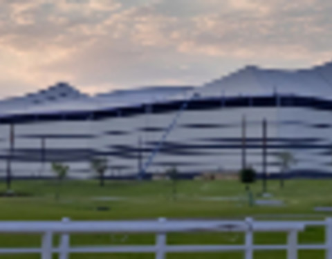 Al Bayt Stadium at sunset.
